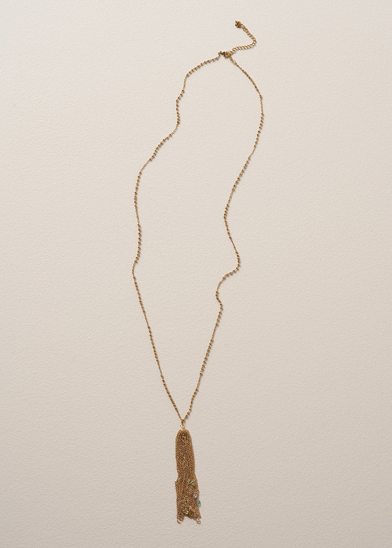 A long chain necklace with gold beads, finished with a multi-strand pendant, and colourful crystals