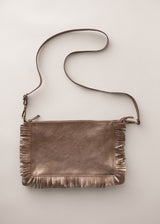 Bronze-coloured leather clutch bag with fringe details on a light gray background