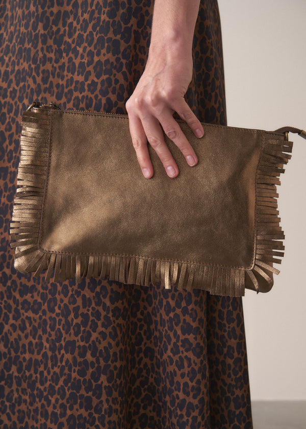 Bronze-coloured leather clutch bag with fringe details on a light gray background