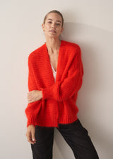 Woman wearing bright red mohair blend cardigan