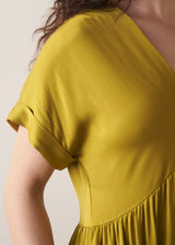 Woman wearing chartreuse yellow satin midi dress
