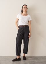 Woman wearing blue black straight leg denim jeans