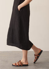 Woman wearing black linen cocoon dress