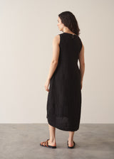Woman wearing black linen cocoon dress