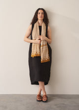 Woman wearing black linen cocoon dress