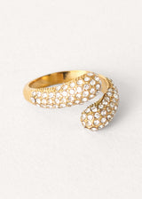 Chunky gold crystal ring on plain background