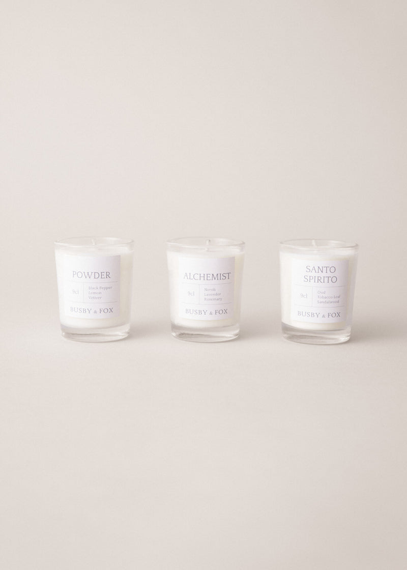 Set of three scented candles, on a beige background