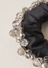 Close up of bead detail on black satin hair scrunchie