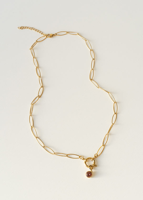 Gold chain necklace with pink crystal