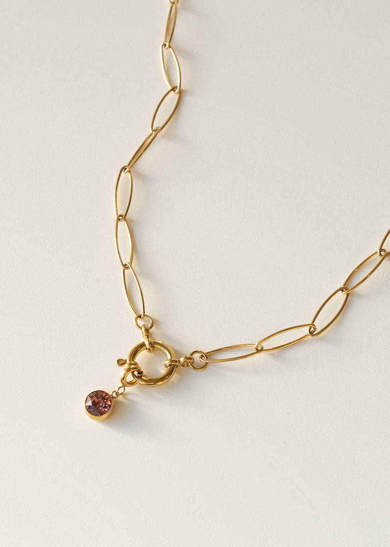 Gold chain necklace with pink crystal