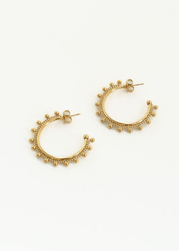 Gold hoop earrings with ball detail