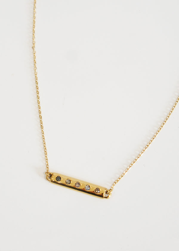 Gold necklace with bar and grey crystals