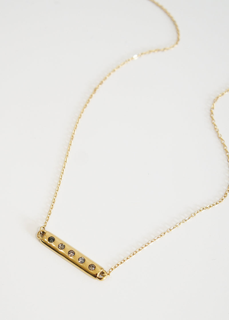 Gold necklace with bar and grey crystals